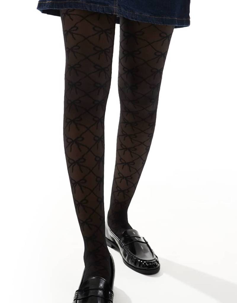 ASOS DESIGN - Strumpfhose in Schwarz mit Monogrammmuster und Schleife von ASOS DESIGN
