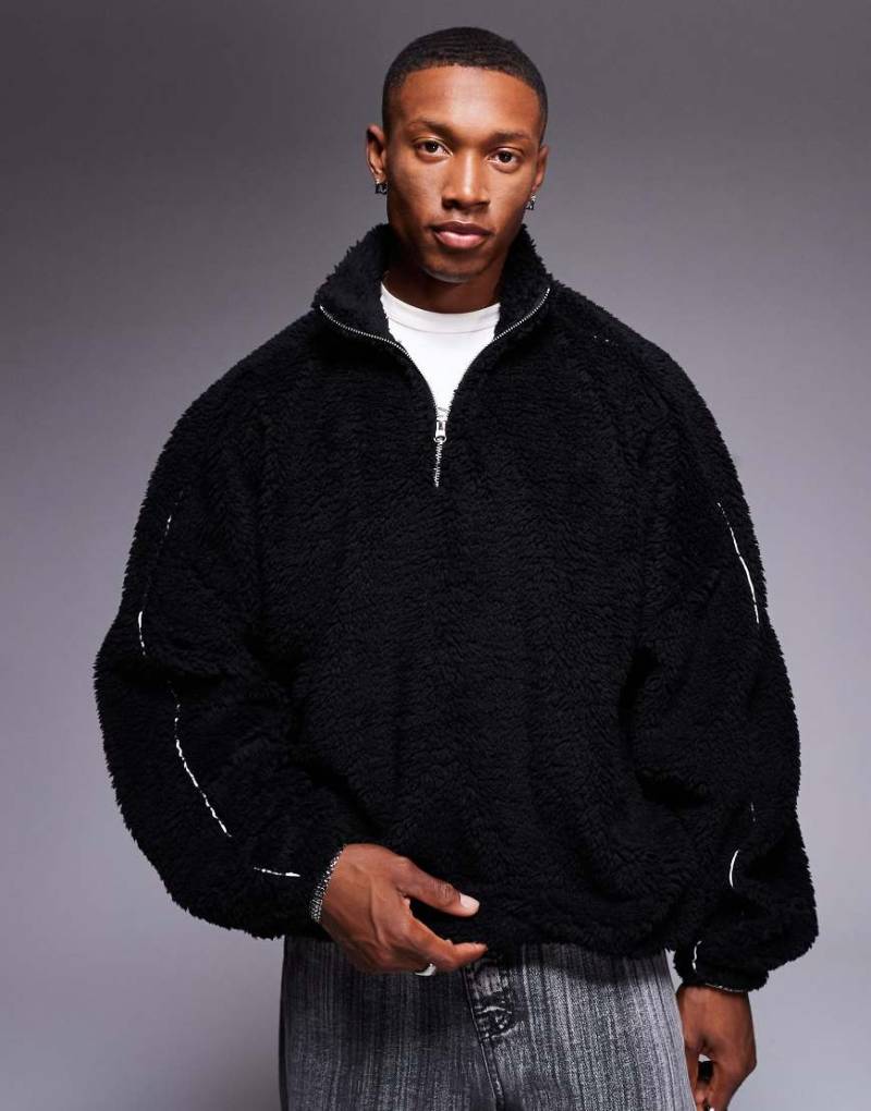 ASOS DESIGN - Super-Oversize-Sweatshirt in Schwarz aus Teddystoff mit kurzem Reißverschluss und Paspelierung von ASOS DESIGN