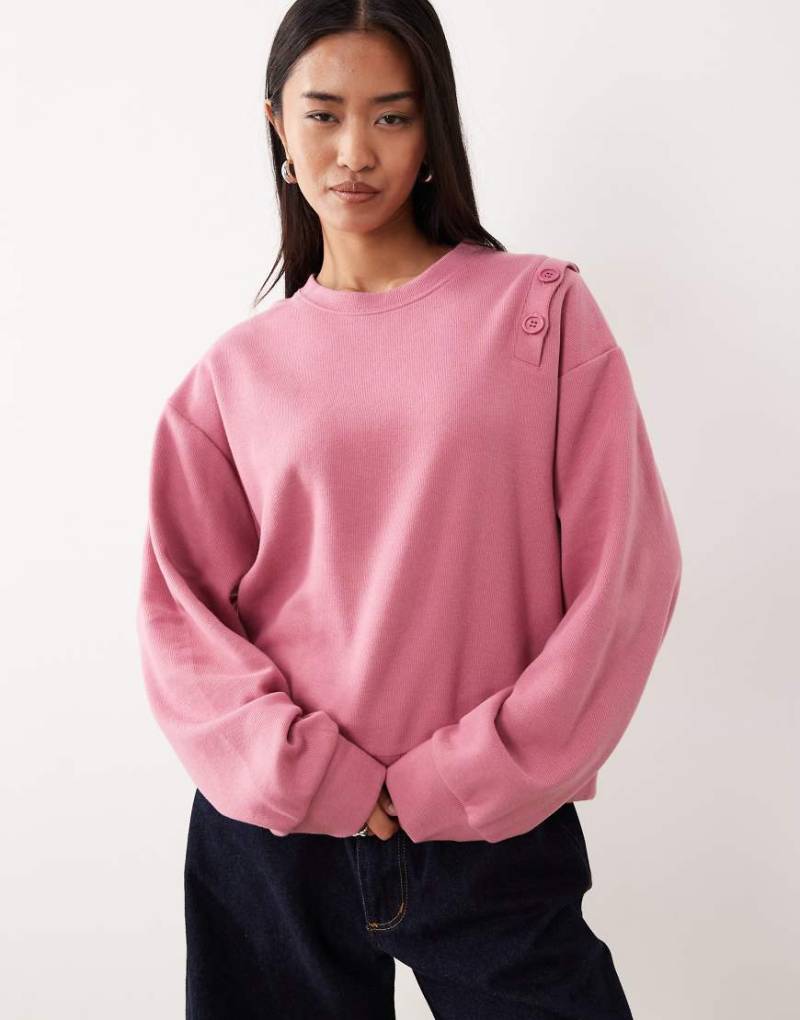 ASOS DESIGN - Superweiches Sweatshirt in Rosa mit Knopfdetail an der Schulter von ASOS DESIGN