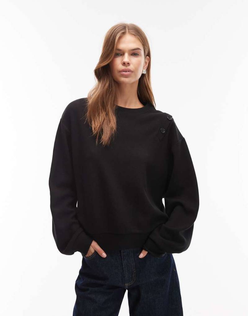 ASOS DESIGN - Superweiches Sweatshirt in Schwarz mit Knopfdetail an der Schulter von ASOS DESIGN