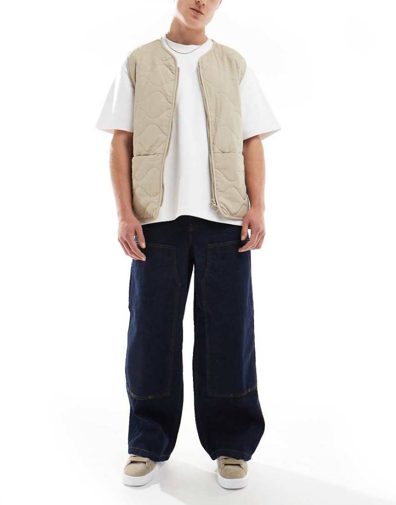 ASOS DESIGN - Superweit geschnittene Carpenter-Jeans in Indigoblau ASOS DESIGN - Superweit geschnittene Carpenter-Jeans in Indigoblau von ASOS DESIGN