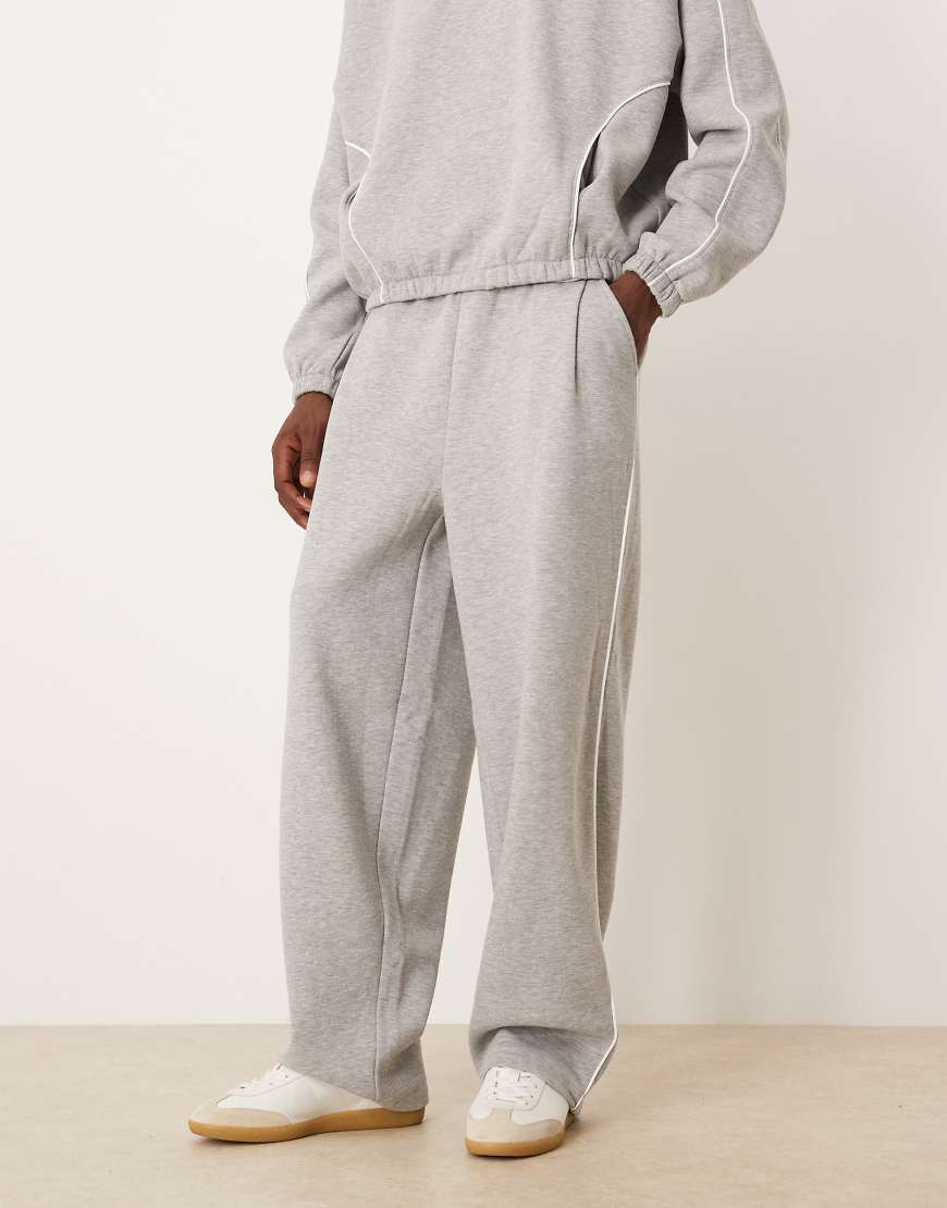 ASOS DESIGN - Superweite Jogginghose in Grau meliert mit seitlicher Paspelierung, Kombiteil von ASOS DESIGN