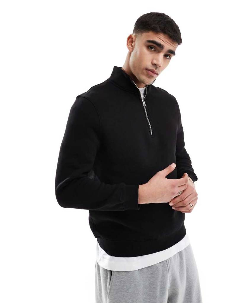 ASOS DESIGN - Sweatshirt in Schwarz mit kurzem Reißverschluss von ASOS DESIGN