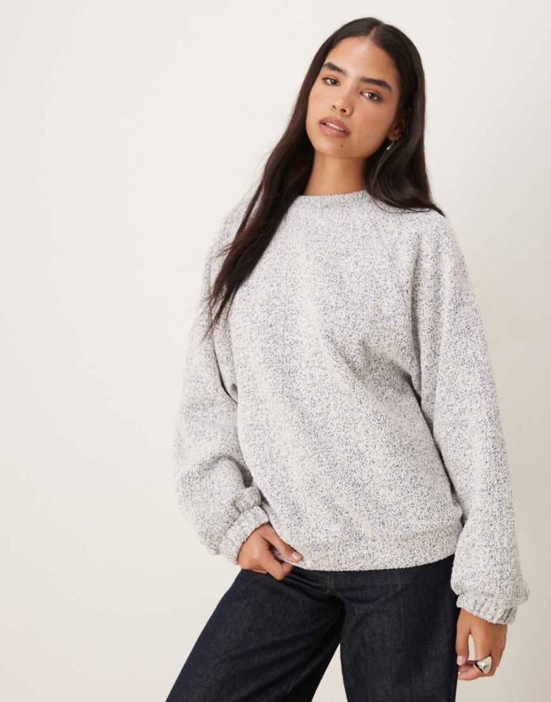 ASOS DESIGN - Sweatshirt in geflecktem Blau mit Bindedetail am Saum von ASOS DESIGN