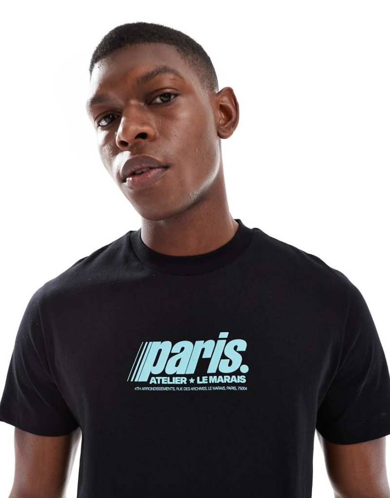 ASOS DESIGN - T-Shirt in Schwarz mit Paris-Grafikprint von ASOS DESIGN