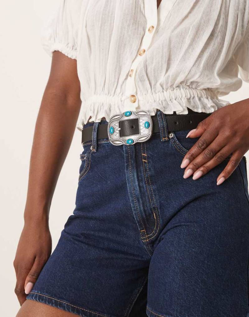 ASOS DESIGN - Hüft- und Taillengürtel in Schwarz mit Schnalle im Western-Stil und türkisfarbenen Schmucksteinen von ASOS DESIGN