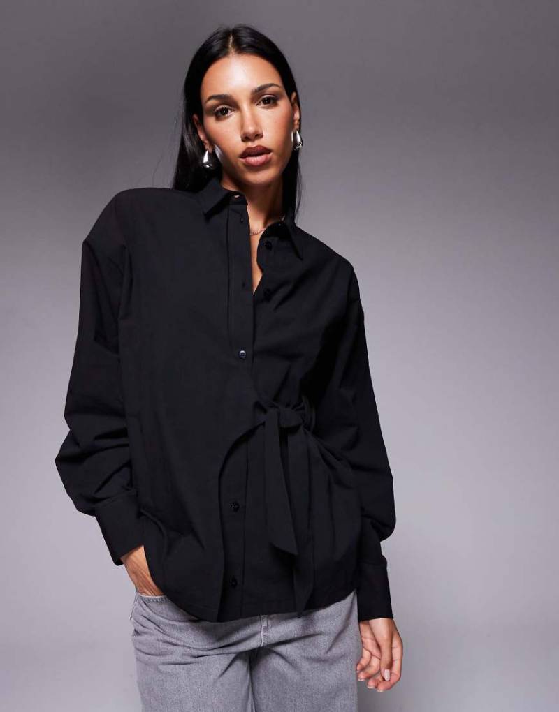 ASOS DESIGN - Taillierte Oversize-Hemdbluse in Schwarz mit gewickeltem Schleifendetail ASOS DESIGN - Taillierte Oversize-Hemdbluse in Schwarz mit gewickeltem Schleifendetail von ASOS DESIGN