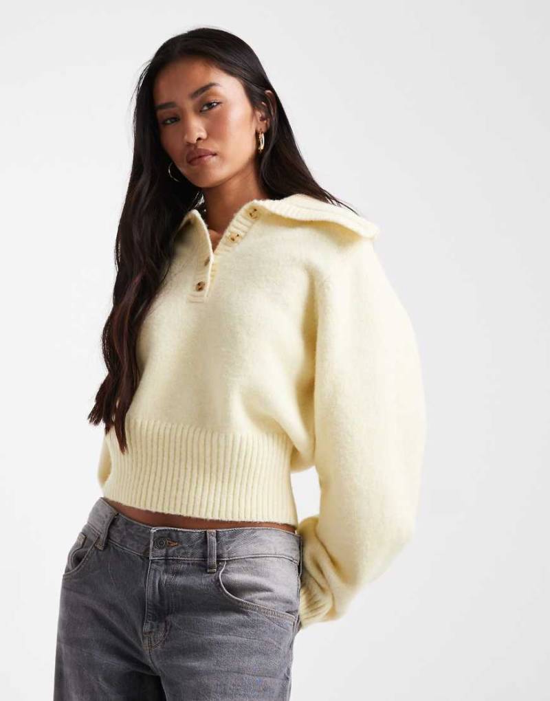 ASOS DESIGN - Tailliertes Polohemd in Buttermilchweiß-Gelb von ASOS DESIGN