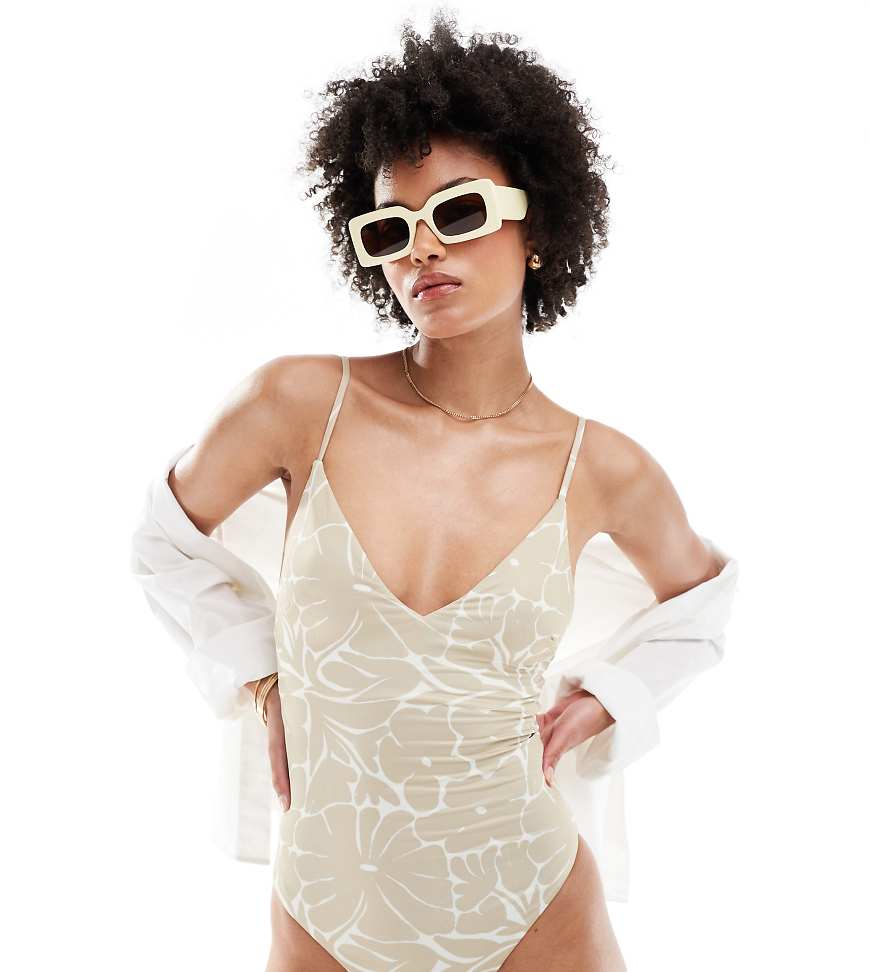ASOS DESIGN Tall - Badeanzug mit V-Ausschnitt und farblich abgestimmtem Blumenmuster-Weiß ASOS DESIGN Tall - Badeanzug mit V-Ausschnitt und farblich abgestimmtem Blumenmuster-Weiß von ASOS Tall