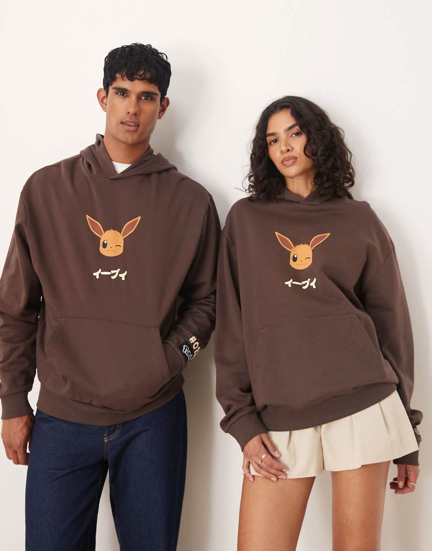 ASOS DESIGN - Unisex-Kapuzenpullover in Braun mit Pokémon-Print und Oversize-Schnitt ASOS DESIGN - Unisex-Kapuzenpullover in Braun mit Pokémon-Print und Oversize-Schnitt von ASOS DESIGN