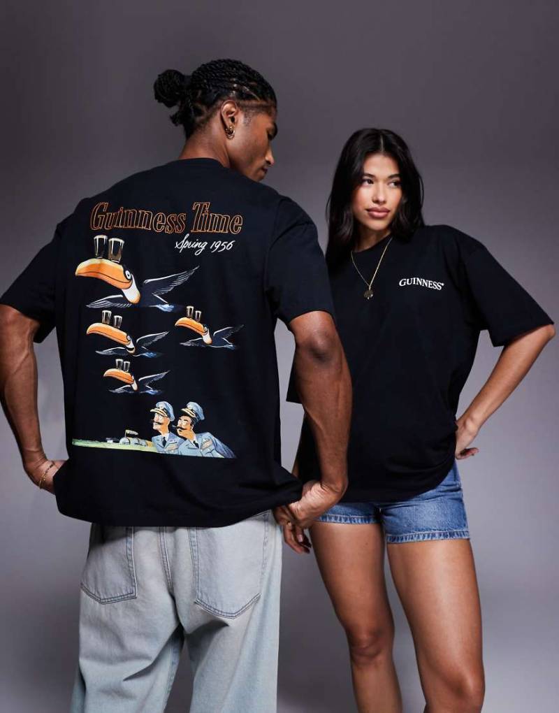 ASOS DESIGN - Unisex-T-Shirt in Schwarz mit „Guinness"-Prints in Oversize-Passform von ASOS DESIGN