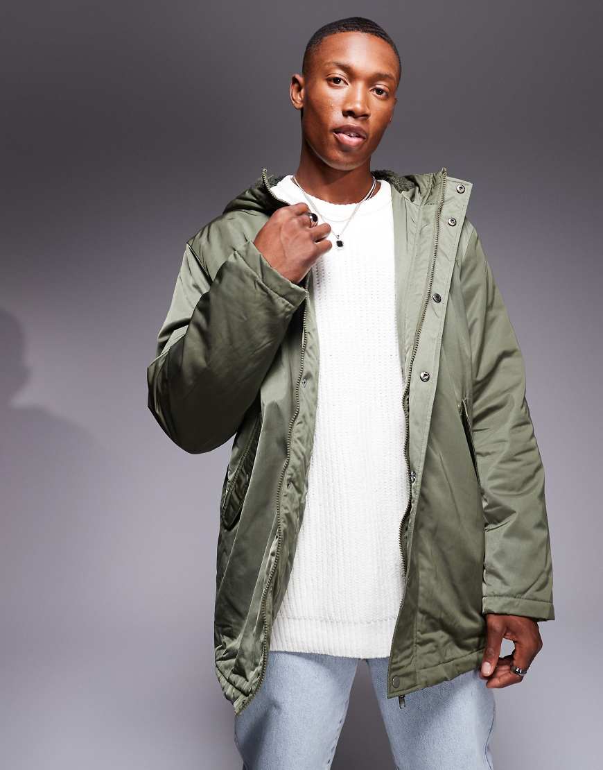 ASOS DESIGN - Wattierter Parka in Khaki mit Teddyfell-Futter-Grün ASOS DESIGN - Wattierter Parka in Khaki mit Teddyfell-Futter-Grün von ASOS DESIGN