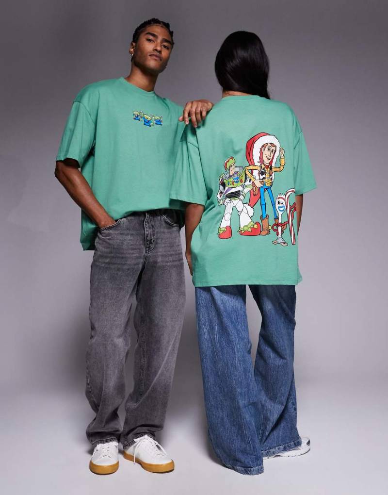 ASOS DESIGN Weihnachten - Disney Pixar - Unisex-T-Shirt in Grün mit „Toy Story"-Motivprints und Oversize-Schnitt von ASOS DESIGN