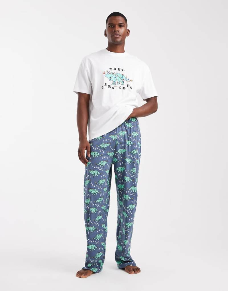 ASOS DESIGN - Weihnachtlicher Pyjama in Marineblau mit Dinosauriermotiv von ASOS DESIGN