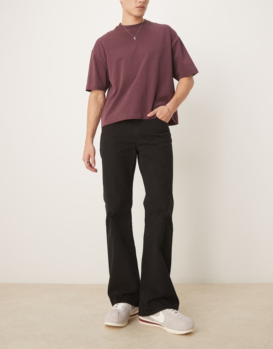 ASOS DESIGN - Weit ausgestellte Jeans in schwarzer Waschung ASOS DESIGN - Weit ausgestellte Jeans in schwarzer Waschung von ASOS DESIGN