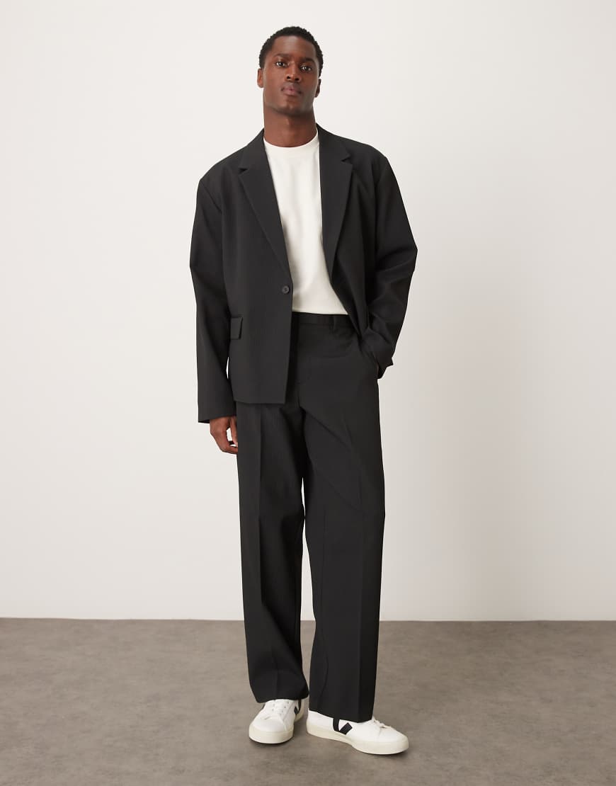 ASOS DESIGN - Weite, gerippte Anzughose in Schwarz von ASOS DESIGN