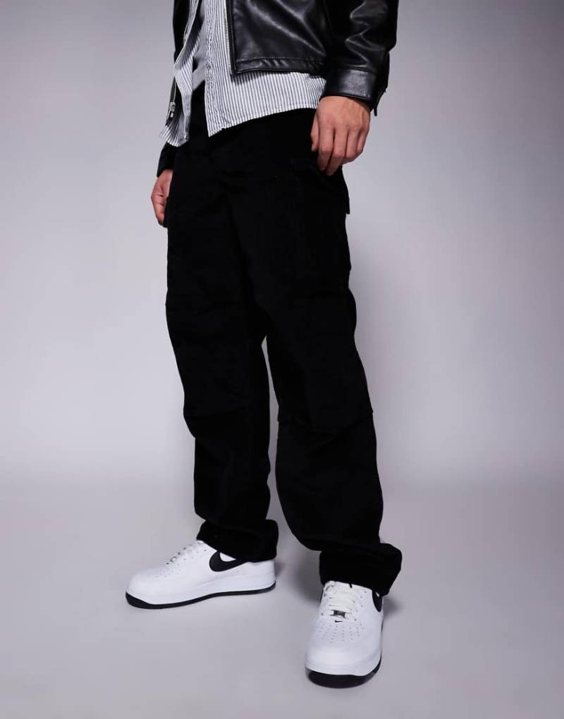 ASOS DESIGN - Weite Cargohose aus Cord in Schwarz von ASOS DESIGN