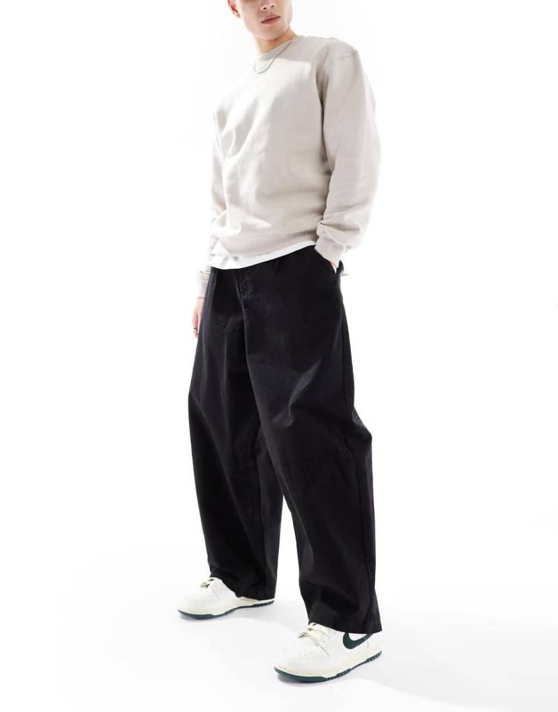 ASOS DESIGN - Weite Oversize-Chinohose in Schwarz von ASOS DESIGN