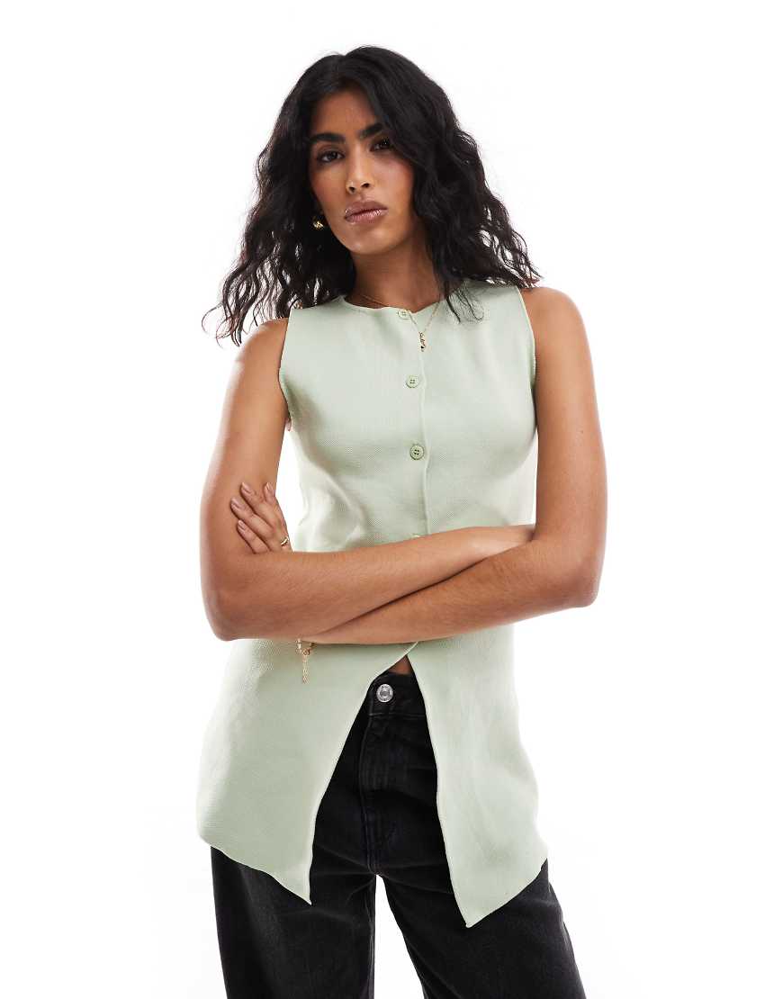 ASOS DESIGN - Weste aus Strick in Pistaziengrün mit Rundhalsausschnitt und Schlitz vorne ASOS DESIGN - Weste aus Strick in Pistaziengrün mit Rundhalsausschnitt und Schlitz vorne von ASOS DESIGN
