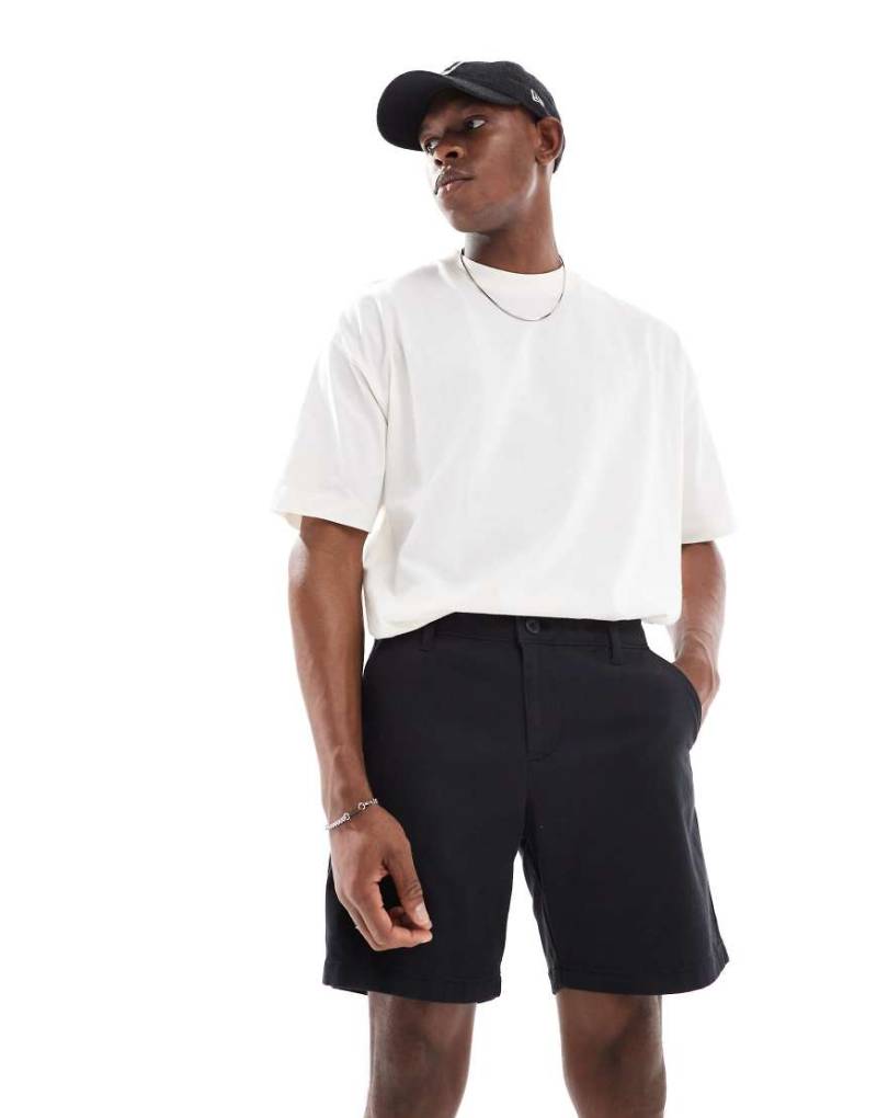 ASOS Design - Enge Chino-Shorts in Schwarz mit mittlerer Länge von ASOS DESIGN