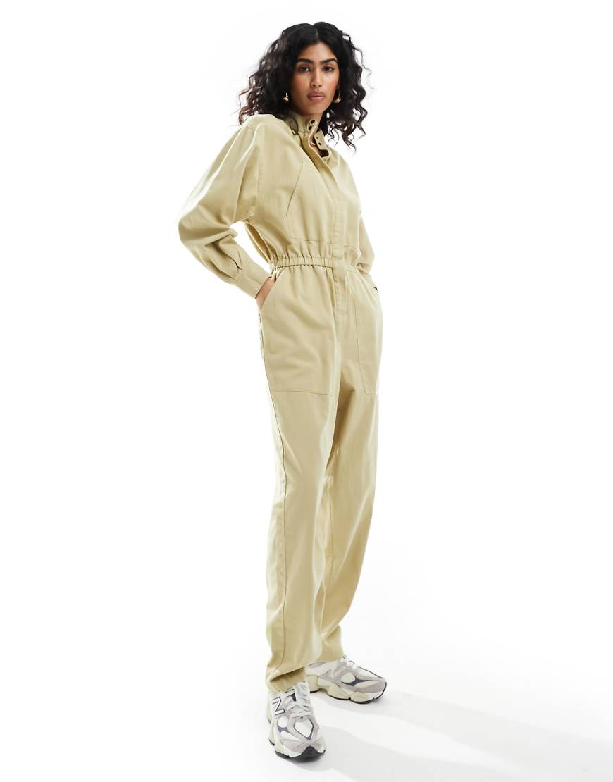 ASOS Design - Jumpsuit in Sand mit elastischem Bund, schmal zulaufendem Bein und verdeckter Knopfleiste-Neutral ASOS Design - Jumpsuit in Sand mit elastischem Bund, schmal zulaufendem Bein und verdeckter Knopfleiste-Neutral von ASOS DESIGN