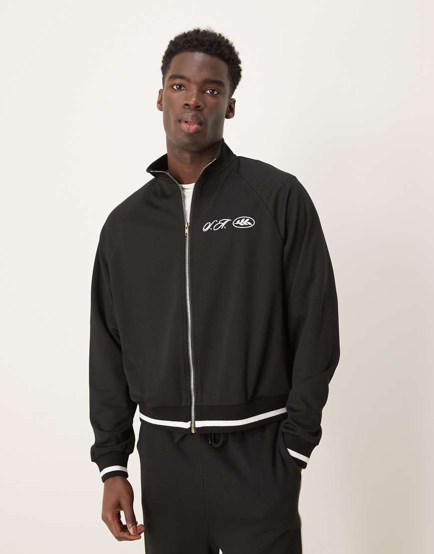 ASOS Design - Oversize-Trainingsjacke aus Piqué in Schwarz ASOS Design - Oversize-Trainingsjacke aus Piqué in Schwarz von ASOS DESIGN