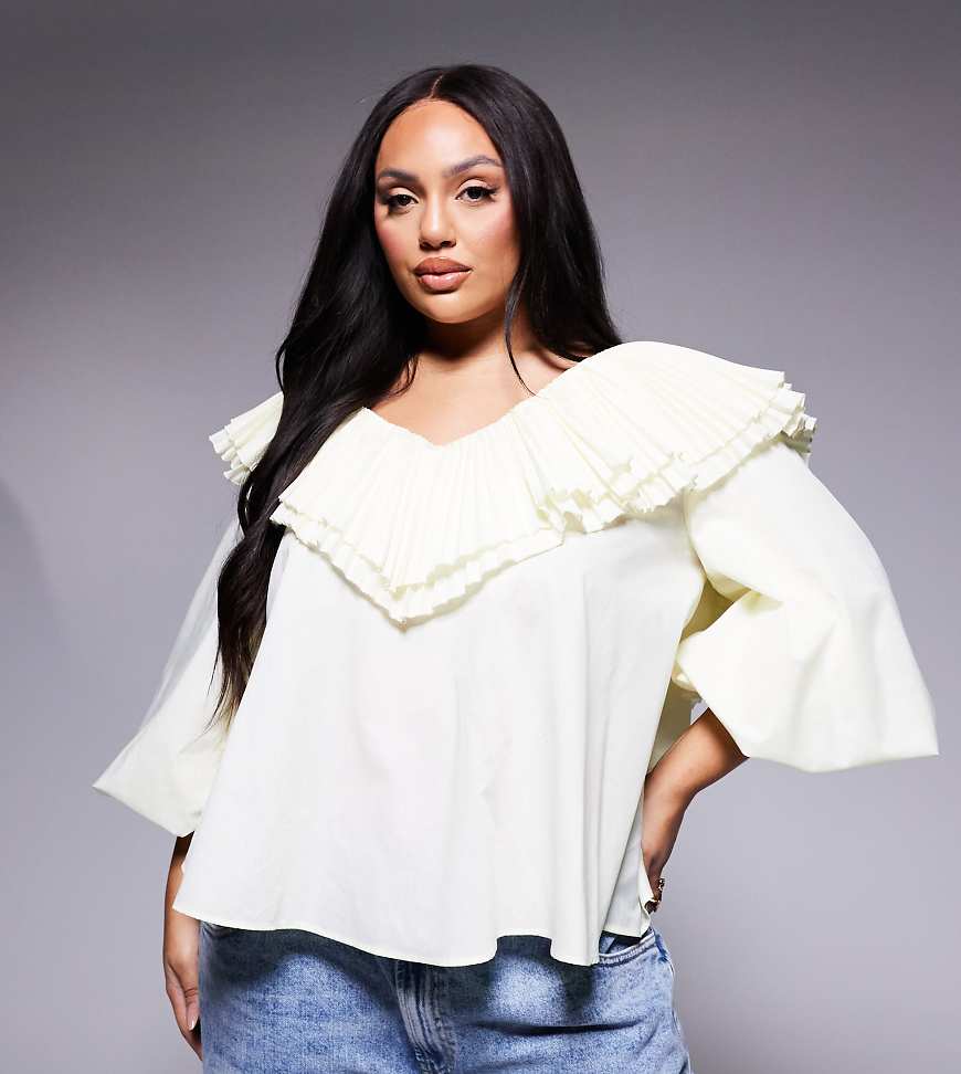 ASOS LUXE Curve - Plissierte Oversize-Bluse aus Baumwoll-Popeline in Buttermilchgelb ASOS LUXE Curve - Plissierte Oversize-Bluse aus Baumwoll-Popeline in Buttermilchgelb von ASOS LUXE