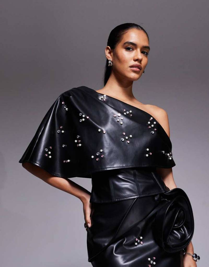 ASOS LUXE - PU-Korsett-Oberteil in Schwarz mit Verzierung und Rüschen-Overlay ASOS LUXE - PU-Korsett-Oberteil in Schwarz mit Verzierung und Rüschen-Overlay von ASOS LUXE