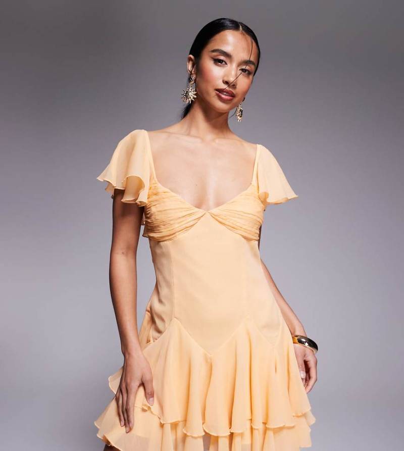 ASOS DESIGN Petite - Minikleid in Blassorange mit weitem Rock und tief angesetzter Taille von ASOS Petite