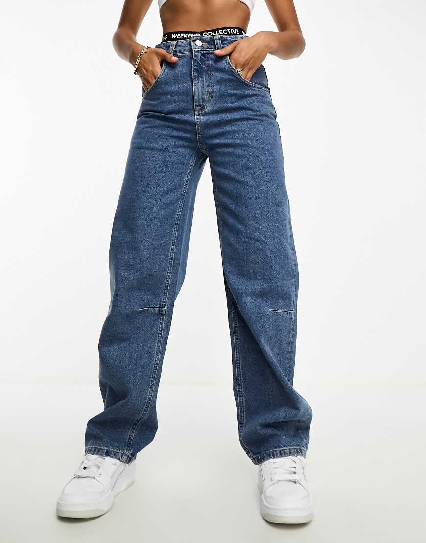 Weekend Collective - Weit geschnittene Jeans in mittelblauer Waschung Weekend Collective - Weit geschnittene Jeans in mittelblauer Waschung von ASOS Weekend Collective