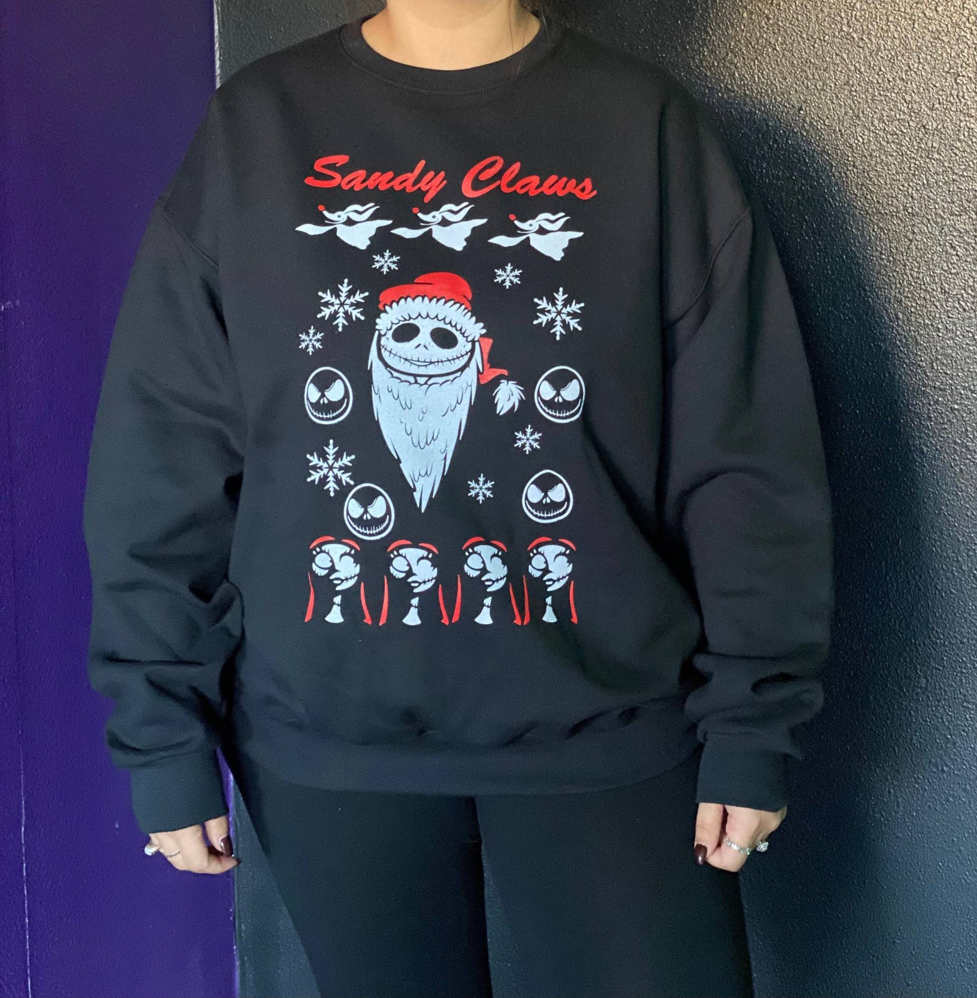 Sandy Claws Weihnachtspullover von AWickedBootique