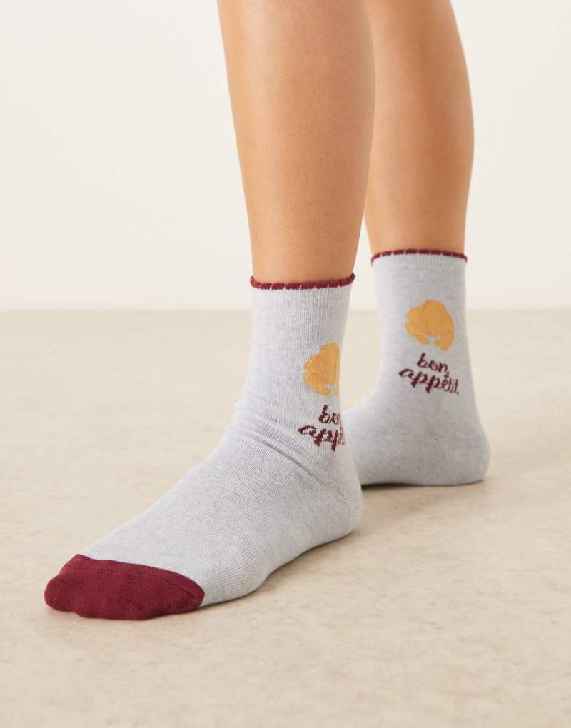 Accessorize - Blaue Socken mit „Bon Appetit"-Croissant-Motiv von Accessorize