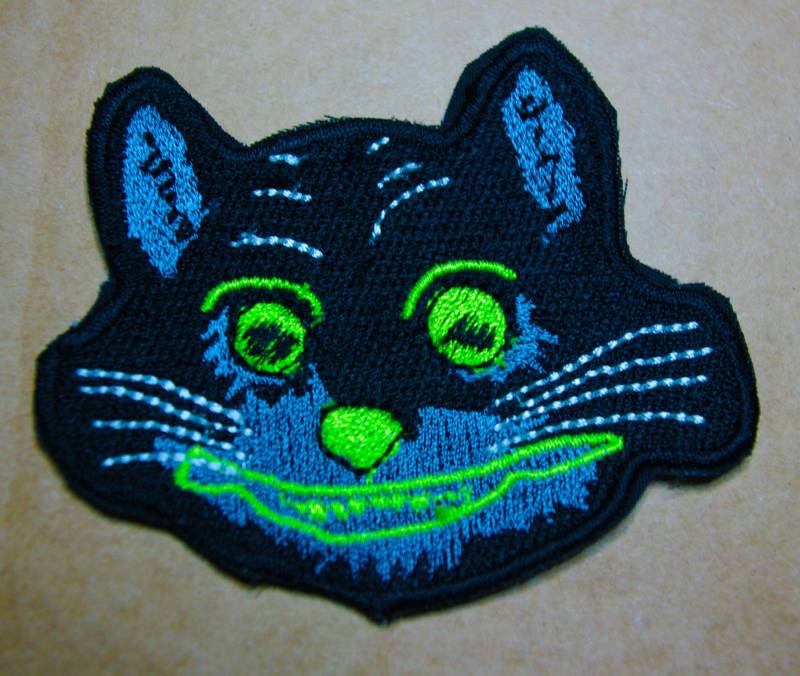 Uv Leuchtende Grinsekatze Aufnäher von AlleyKatGB