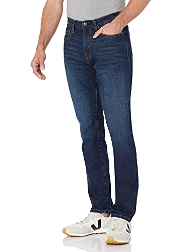 Amazon Essentials Herren Stretchjeans mit lockerer Passform (in Übergrößen erhältlich) - Auslauffarben, Indigo Waschung, 44W / 32L von Amazon Essentials