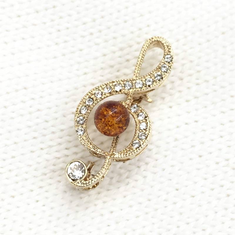 Bernstein Brosche, Zierliche Brosche Mit Bernsteinperle in Cognac, Im Notenschlüssel-Design, Schmuckstück Bernstein Brosche, Zierliche Brosche Mit Bernsteinperle in Cognac, Im Notenschlüssel-Design, Schmuckstück von AmberRichCollection