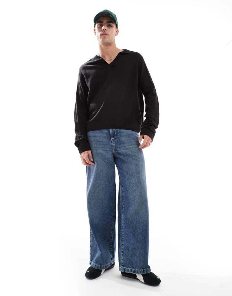 Another Influence - Langärmliger Polo-Pullover in Schwarz mit V-Ausschnitt von Another Influence