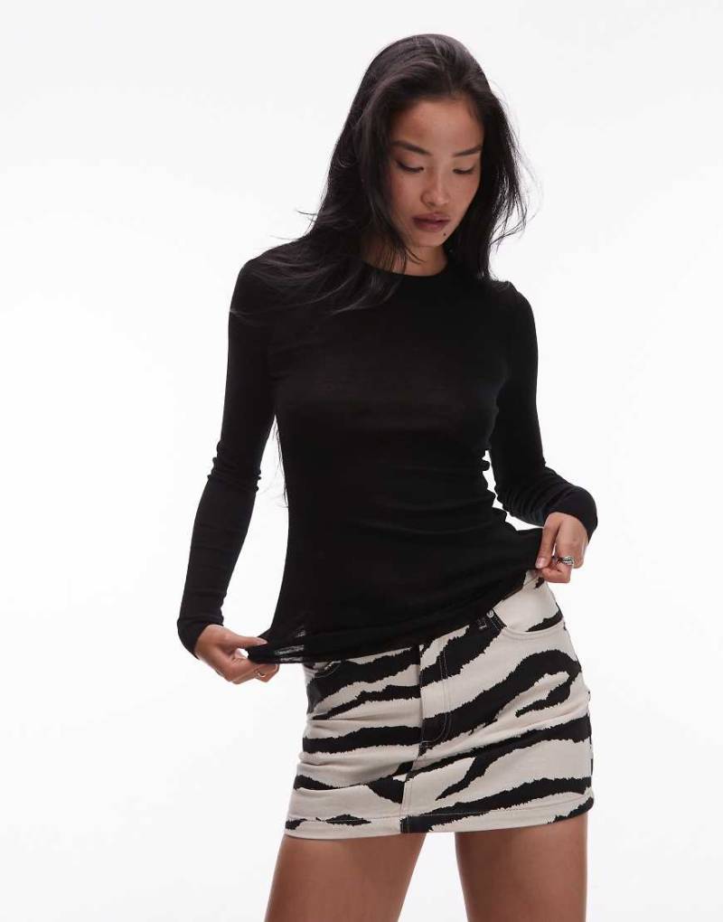 ARKET - Halbtransparentes, langärmliges Strickoberteil aus Merinowolle in Schwarz von Arket