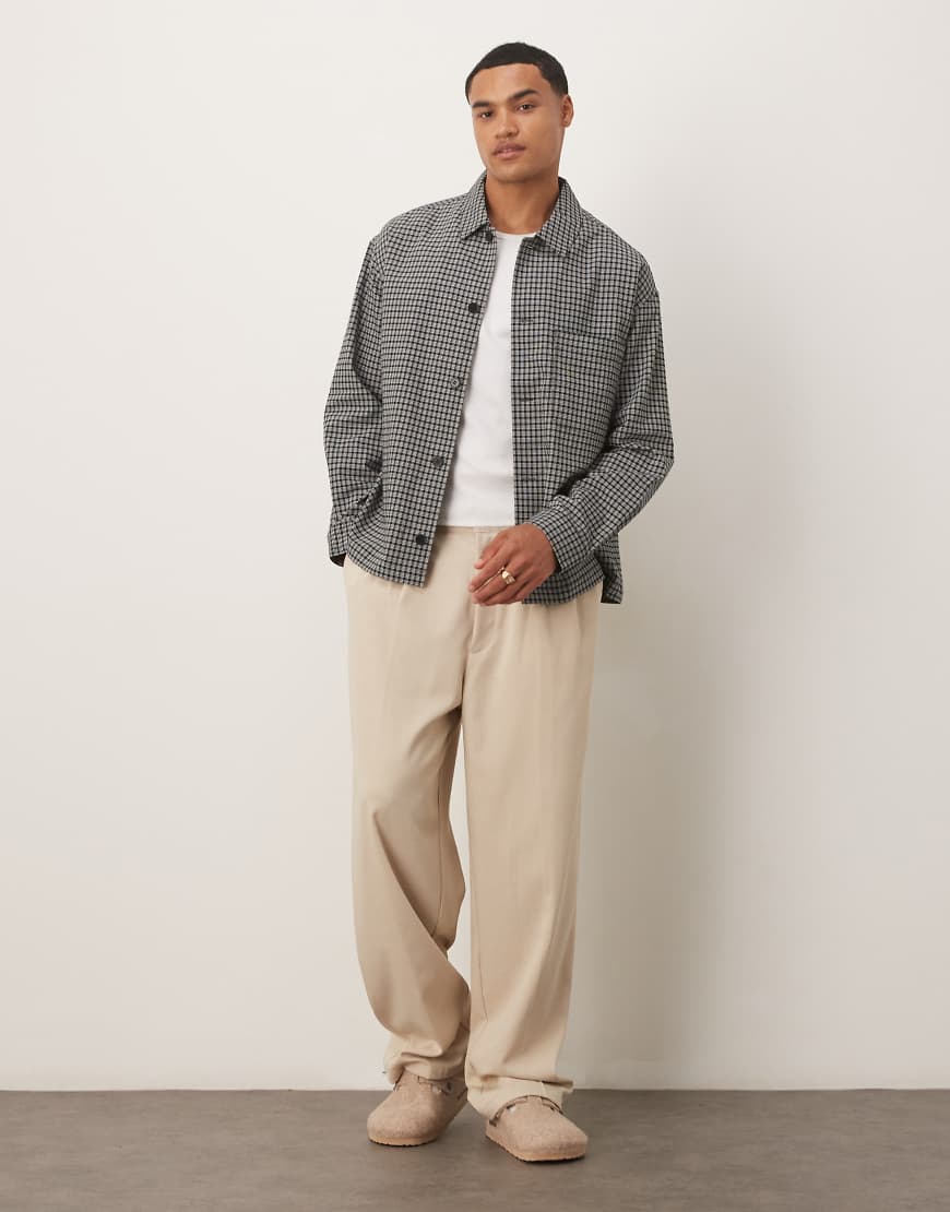 ARKET - Locker geschnittene Hemdjacke aus Seersucker mit hohem Baumwollanteil in Schwarz und Weiß kariert ARKET - Locker geschnittene Hemdjacke aus Seersucker mit hohem Baumwollanteil in Schwarz und Weiß kariert von Arket