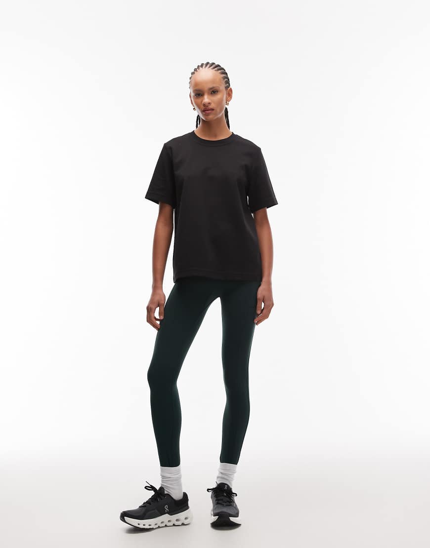 ARKET - Nahtlose Sport-Leggings in Dunkelgrün mit Seitentaschen von Arket