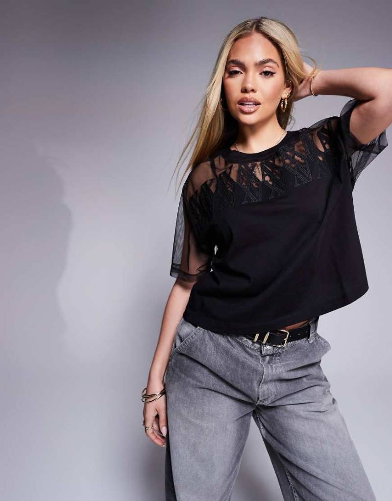 Armani Exchange - Kastiges T-Shirt aus Netzstoff in Schwarz mit Logo von Armani Exchange