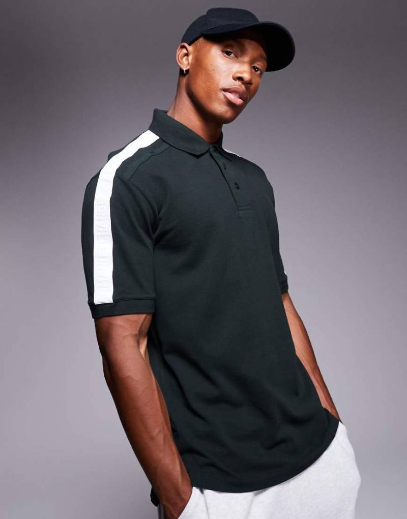 Armani Exchange - Polohemd in Grün mit kontrastierender Logo-Paspelierung von Armani Exchange
