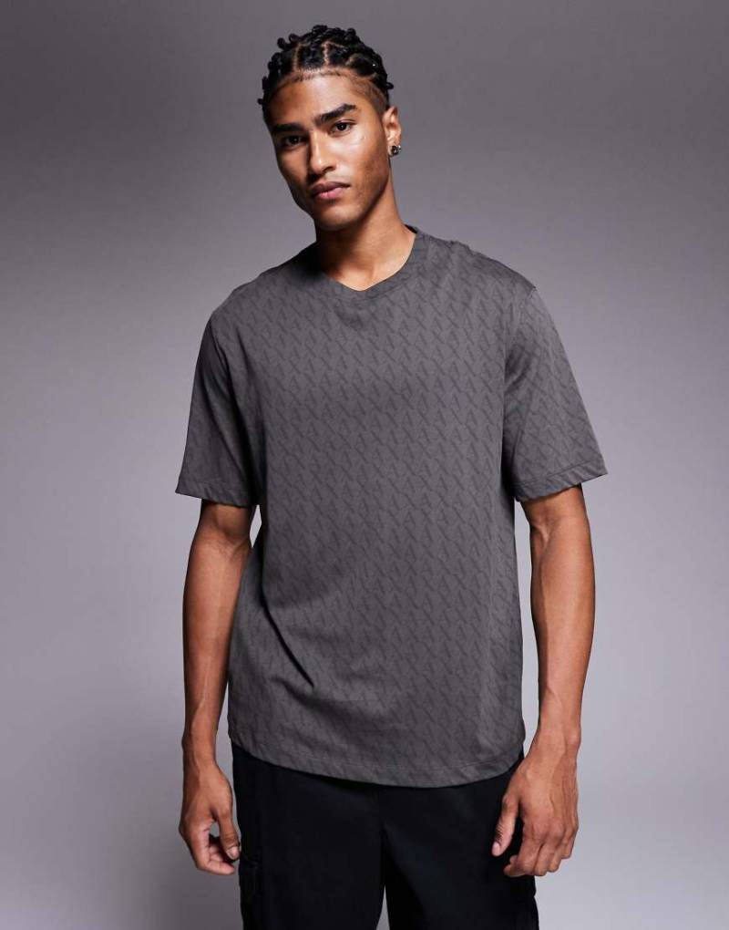 Armani Exchange - T-Shirt in Grün mit Logomuster von Armani Exchange
