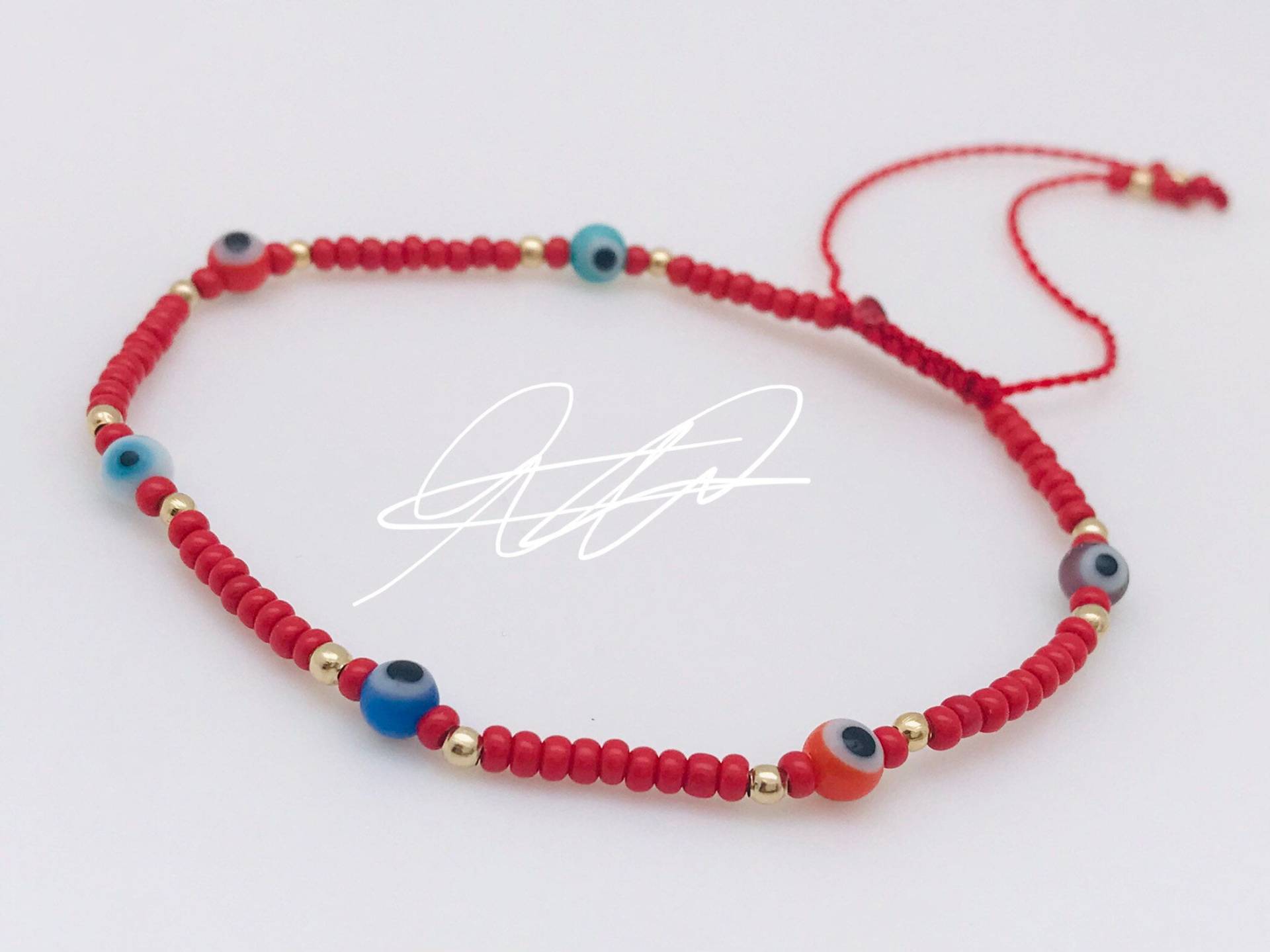 Rotes Armband Mit Bunten Augen Rotes Armband Mit Bunten Augen von ArtesaniaMT