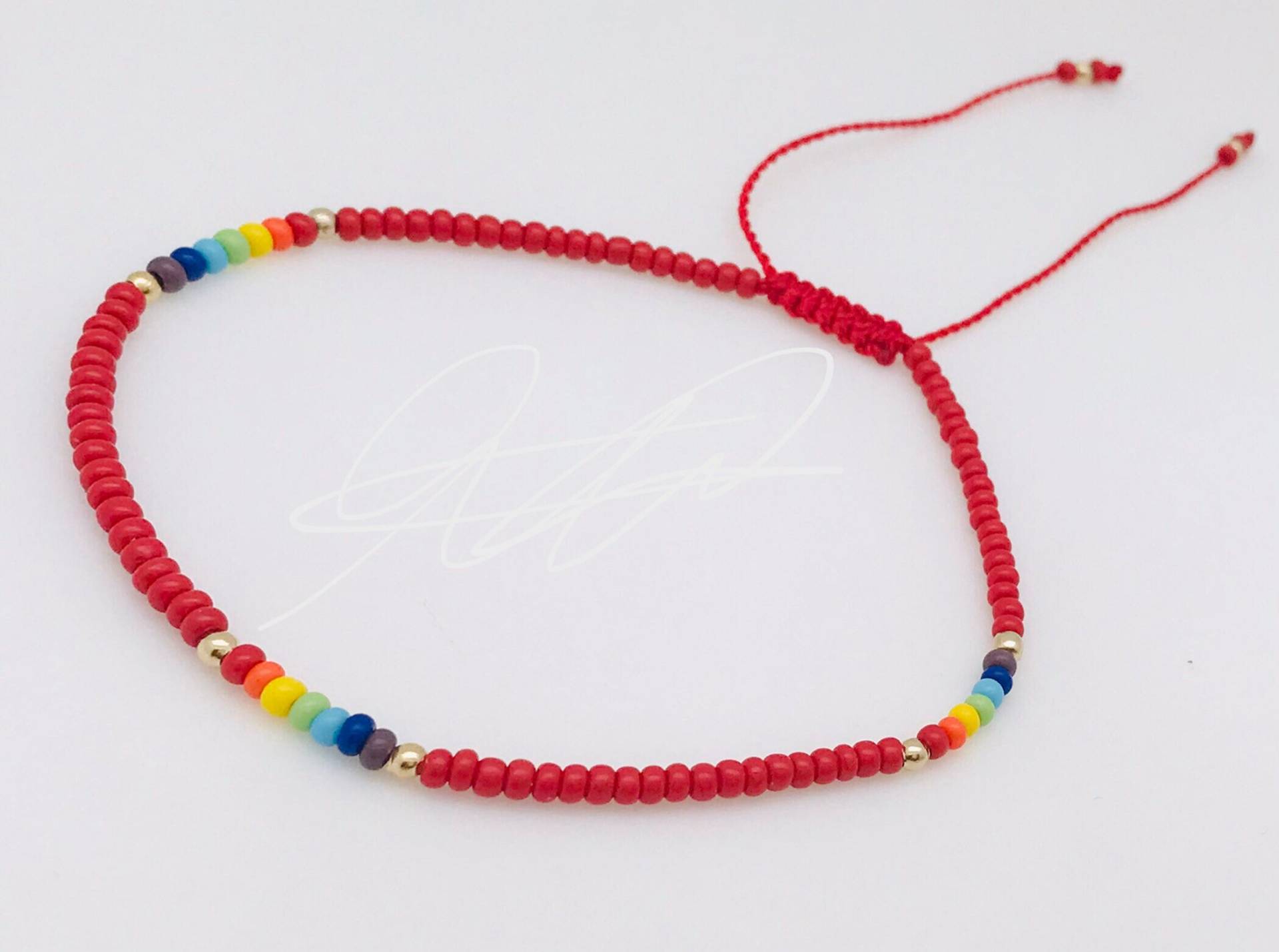 Rotes Armband Mit Den Sieben Chakras Rotes Armband Mit Den Sieben Chakras von ArtesaniaMT
