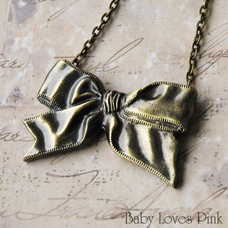 Bronze Ribbon Bow Halskette Bronze Ribbon Bow Halskette von BabyLovesPink