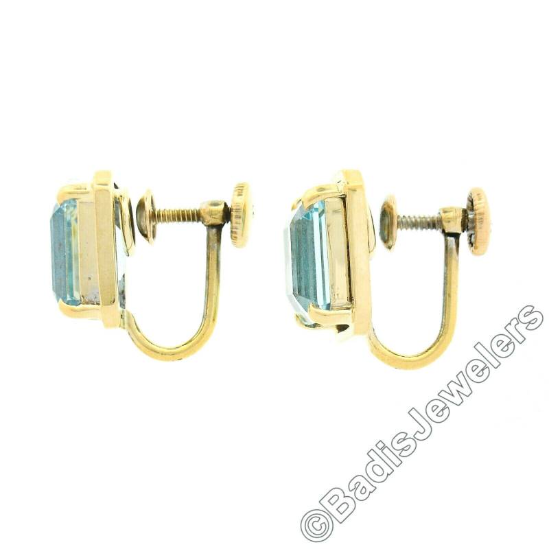 Vintage 14K Gelbgold 6.20Ctw Aquamarin Smaragd Cut Prong Set Mit Poliertem Rahmen Schraubverschluss Ohrstecker in Ausgezeichnetem Zustand von BadisJewelers
