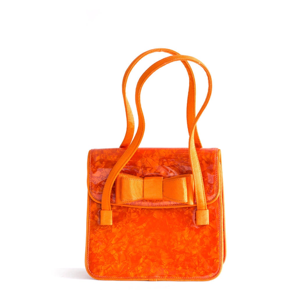 Umhängetasche Aus Orangefarbenem Kunststoff Von Moschino Im Vintage-stil Mit Bogendetails Umhängetasche Aus Orangefarbenem Kunststoff Von Moschino Im Vintage-stil Mit Bogendetails von BagsTalk