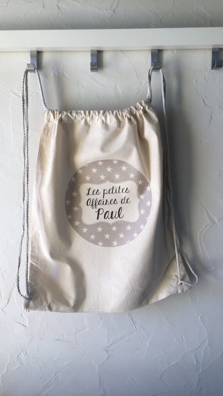 Personalisierter Baumwoll-Rucksack „Les Petites Affaires De ..." 100 % Baumwolle Mit Kordelzug Schneller Versand Kinderstern Personalisierter Baumwoll-Rucksack „Les Petites Affaires De ..." 100 % Baumwolle Mit Kordelzug Schneller Versand Kinderstern von Banasah