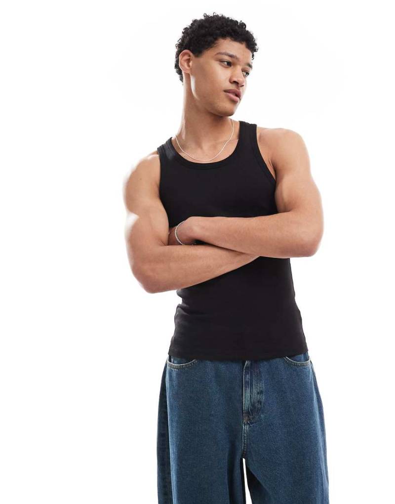 Bershka - Geripptes Trägershirt in Schwarz von Bershka