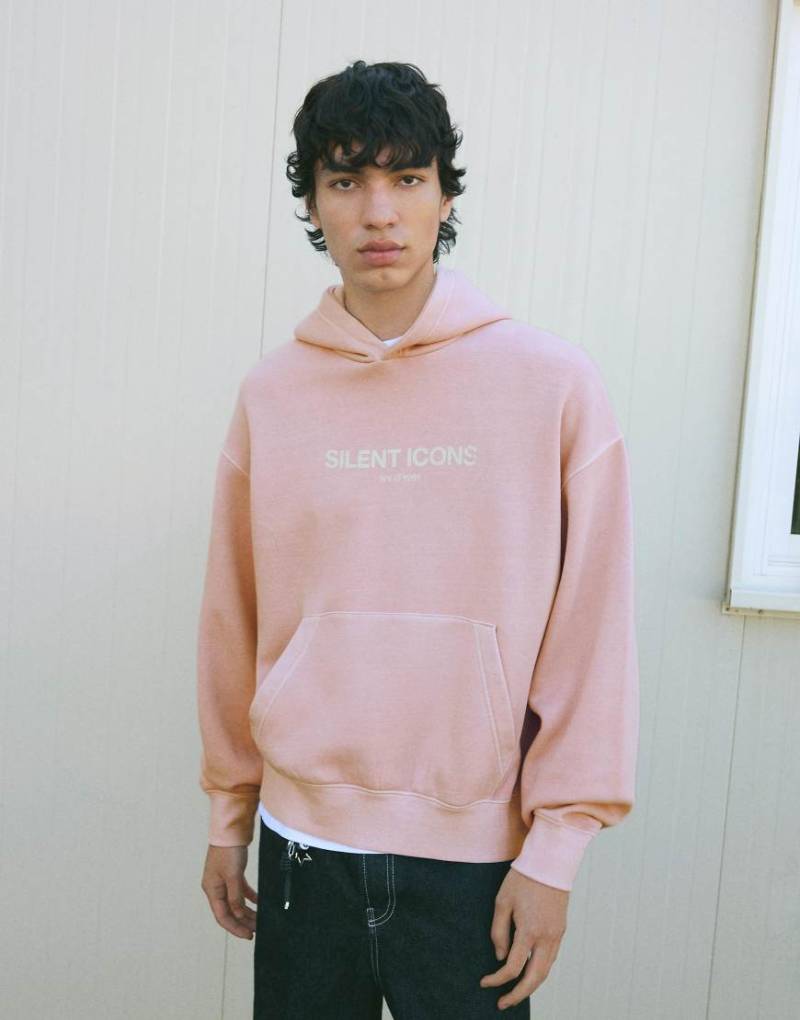 Bershka - Kastiger Kapuzenpullover in verwaschenem Rosa mit Print von Bershka